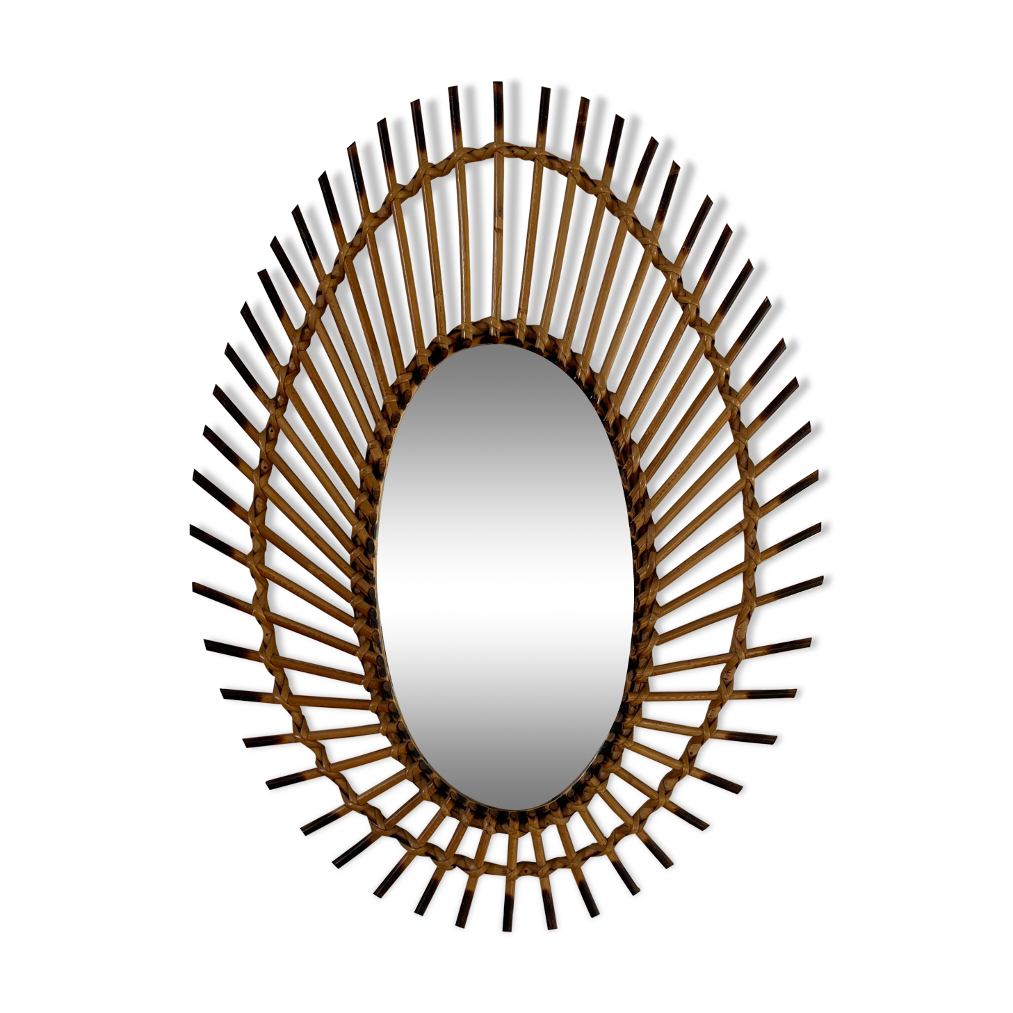 Rattan mirror in the shape of an eye