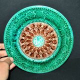 Antique plate in turquoise brown green slip with arabesque decoration