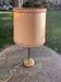 Table lamp, bedside lamp in golden brass, column feet, beige lampshade with trimmings, vintage
