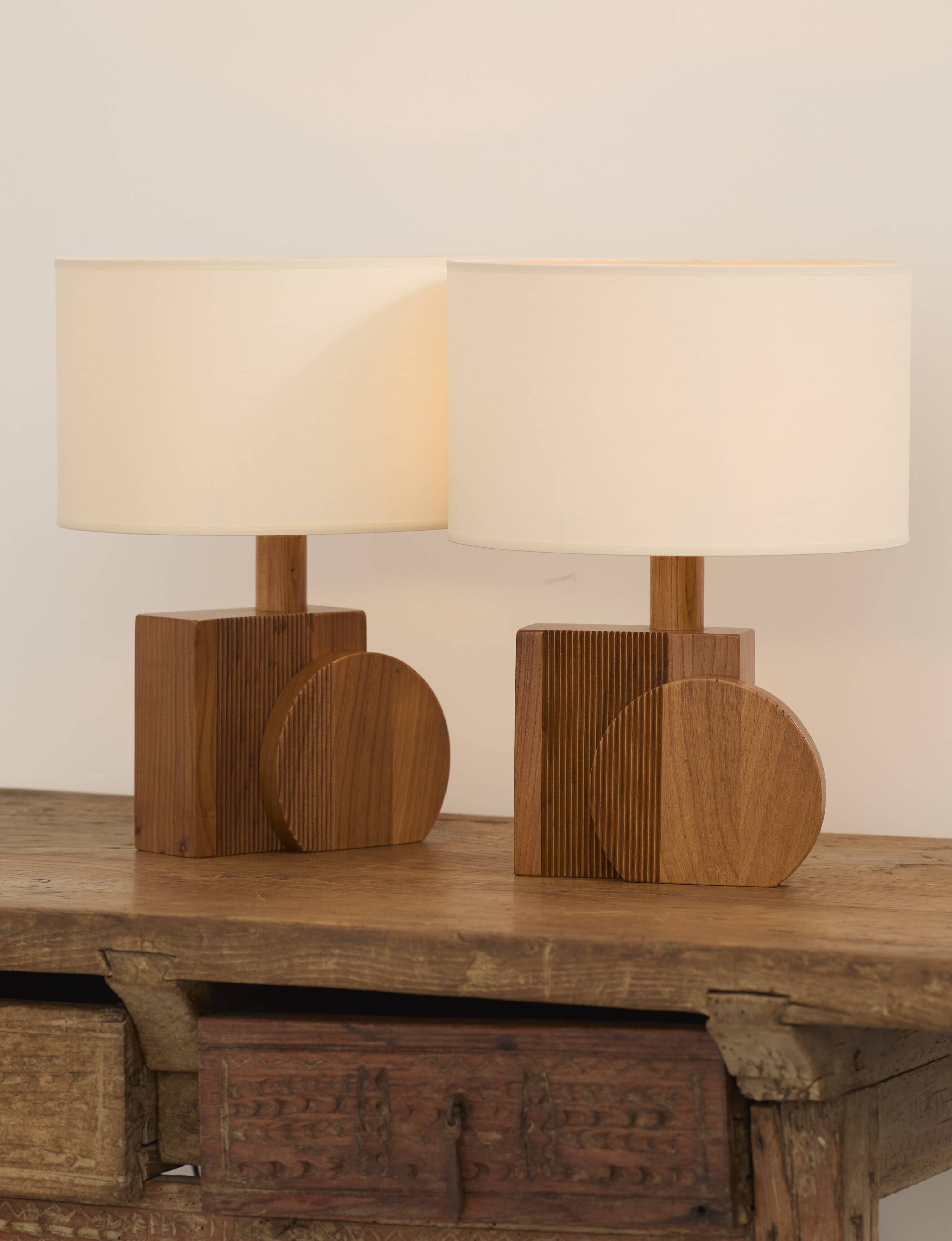 Pair of geometric handcrafted lamps in solid oak circa 1970.