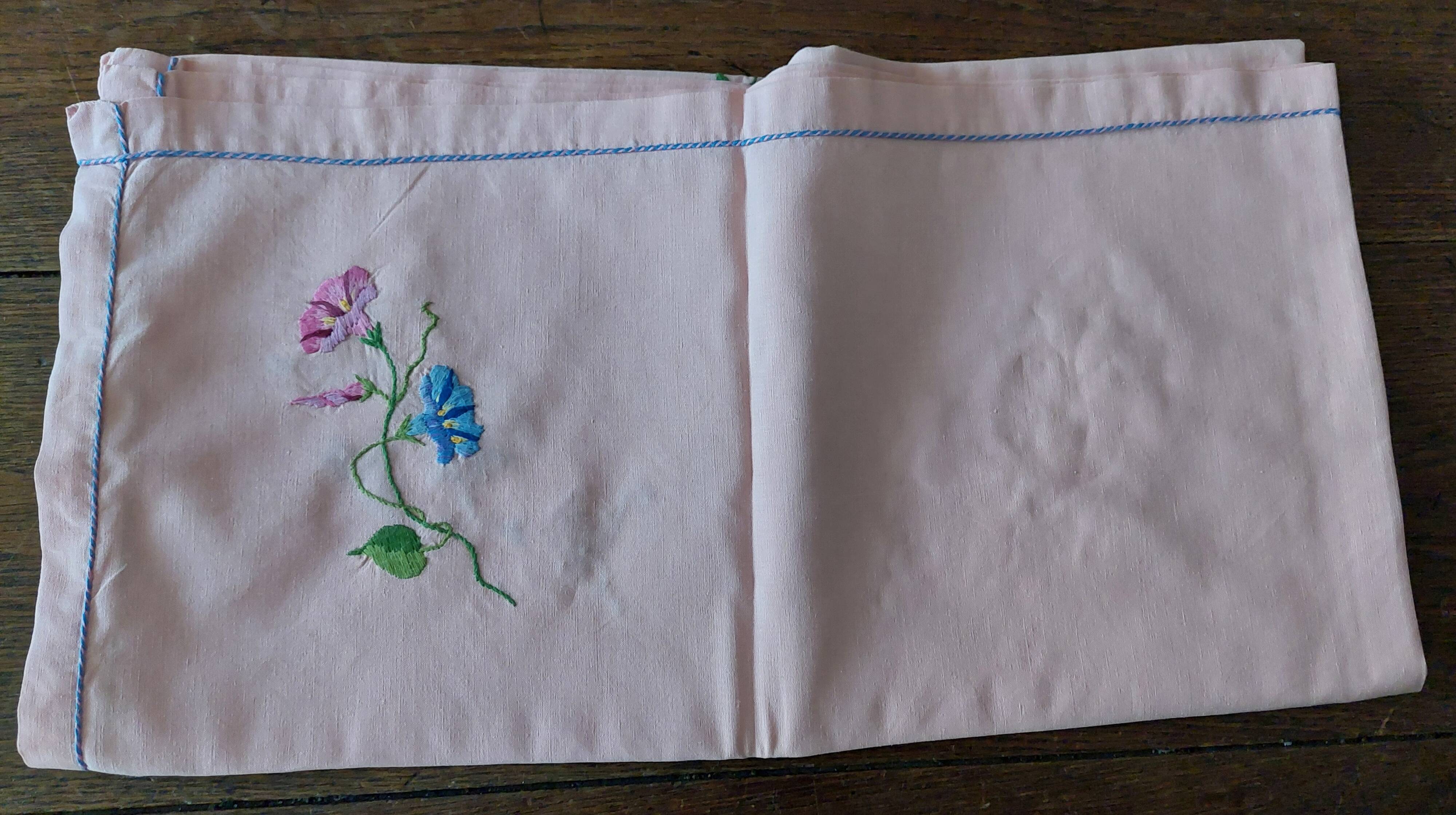 Antique pink cotton tablecloth with embroidered multicolored flowers