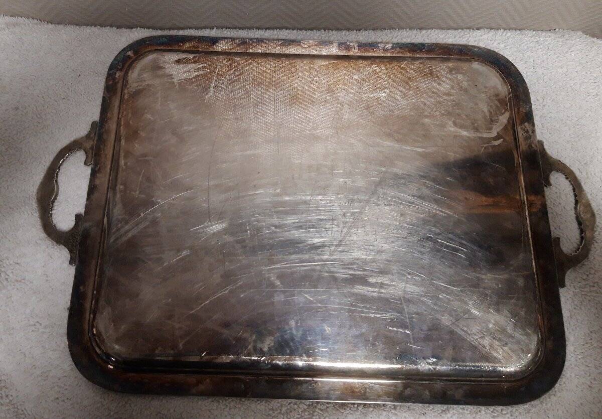 Silver-plated service tray with handles, neoclassical decoration.