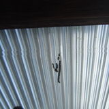 Vestiaire wears hat coat and art deco umbrella in wrought iron patere wood