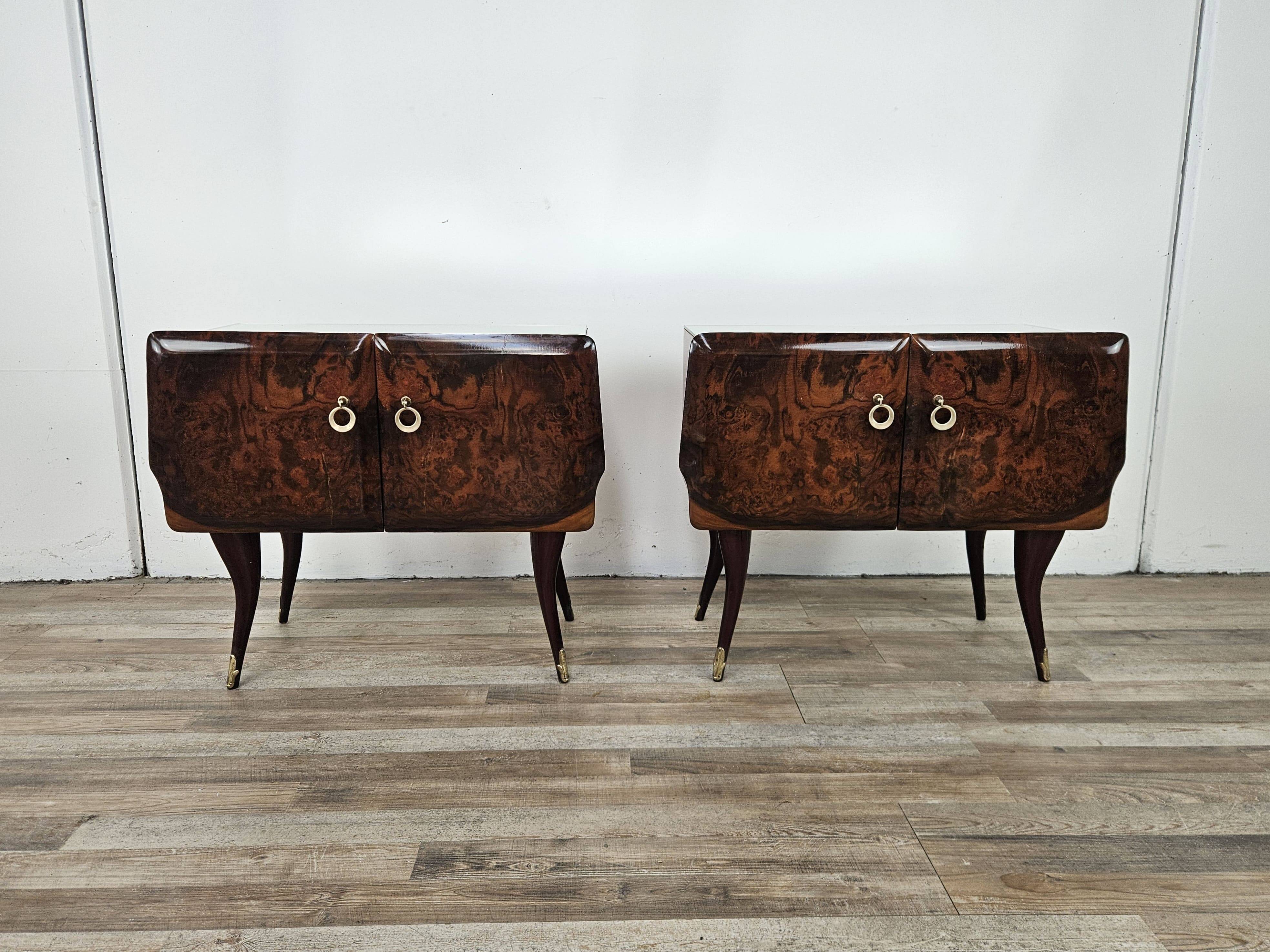 Mid-century mahogany bedside tables with mirrored tops.