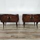 Mid-century mahogany bedside tables with mirrored tops.