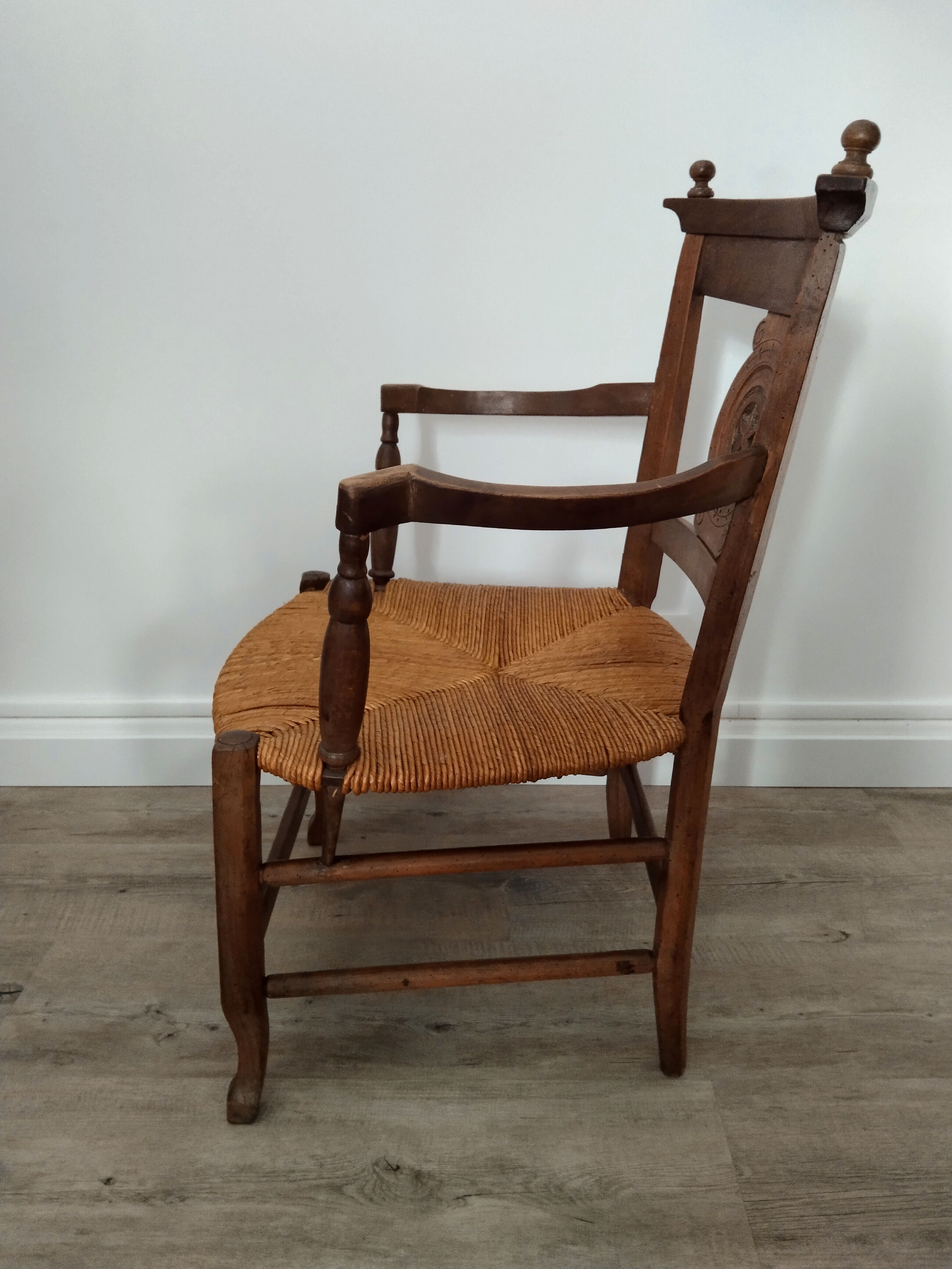 Straw armchair folk art.