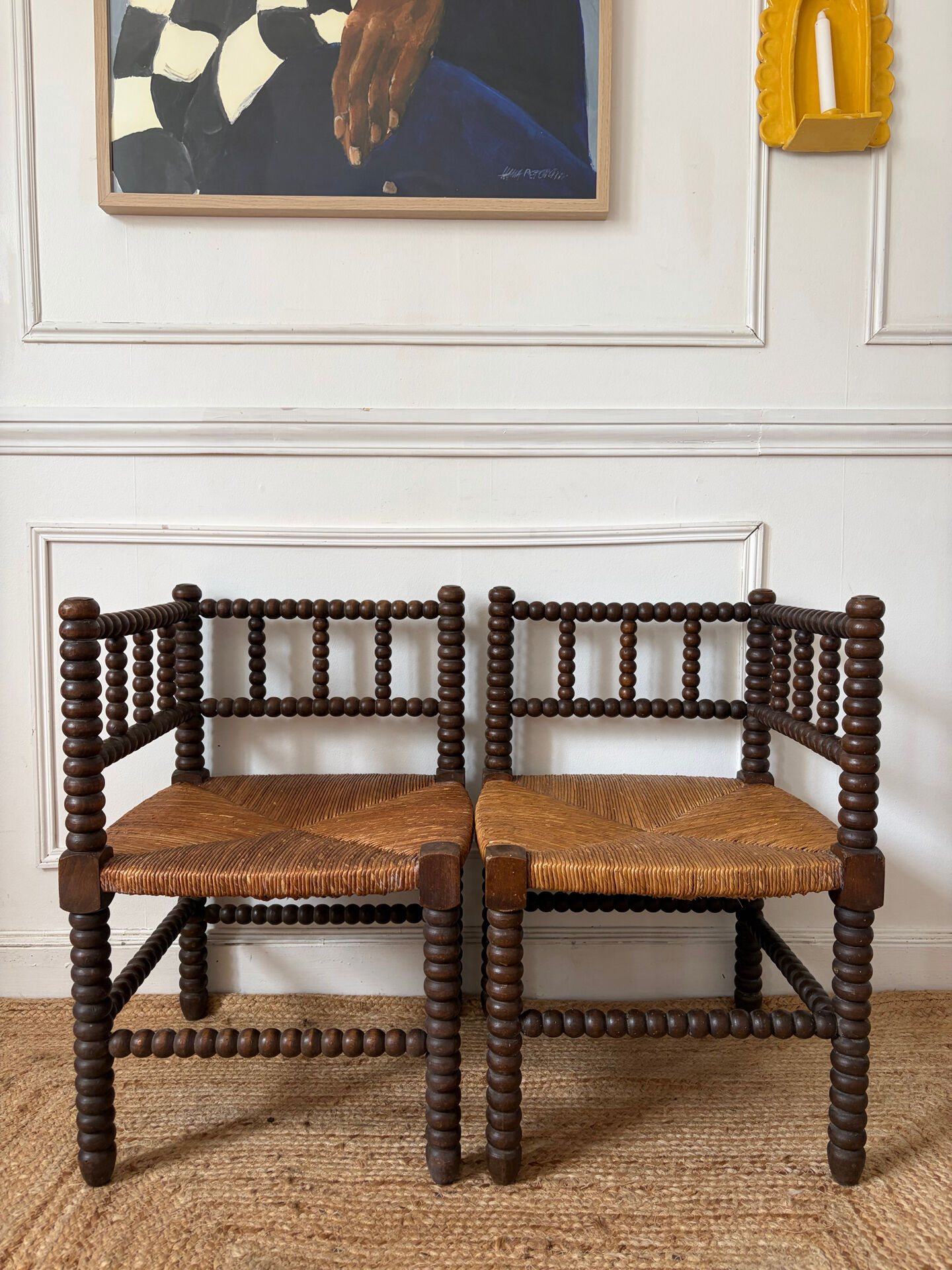 Pair of rush-seated chairs by the fireside "bobbin"