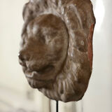 Three cast-iron and terracotta façade decoration lions, around 1880.