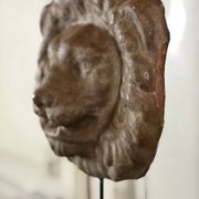 Three cast-iron and terracotta façade decoration lions, around 1880.