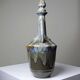 Vintage stoneware bottle with flamed glaze, France 1950-1970.