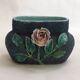 Antique jardinière with rose design in barbotine pottery.