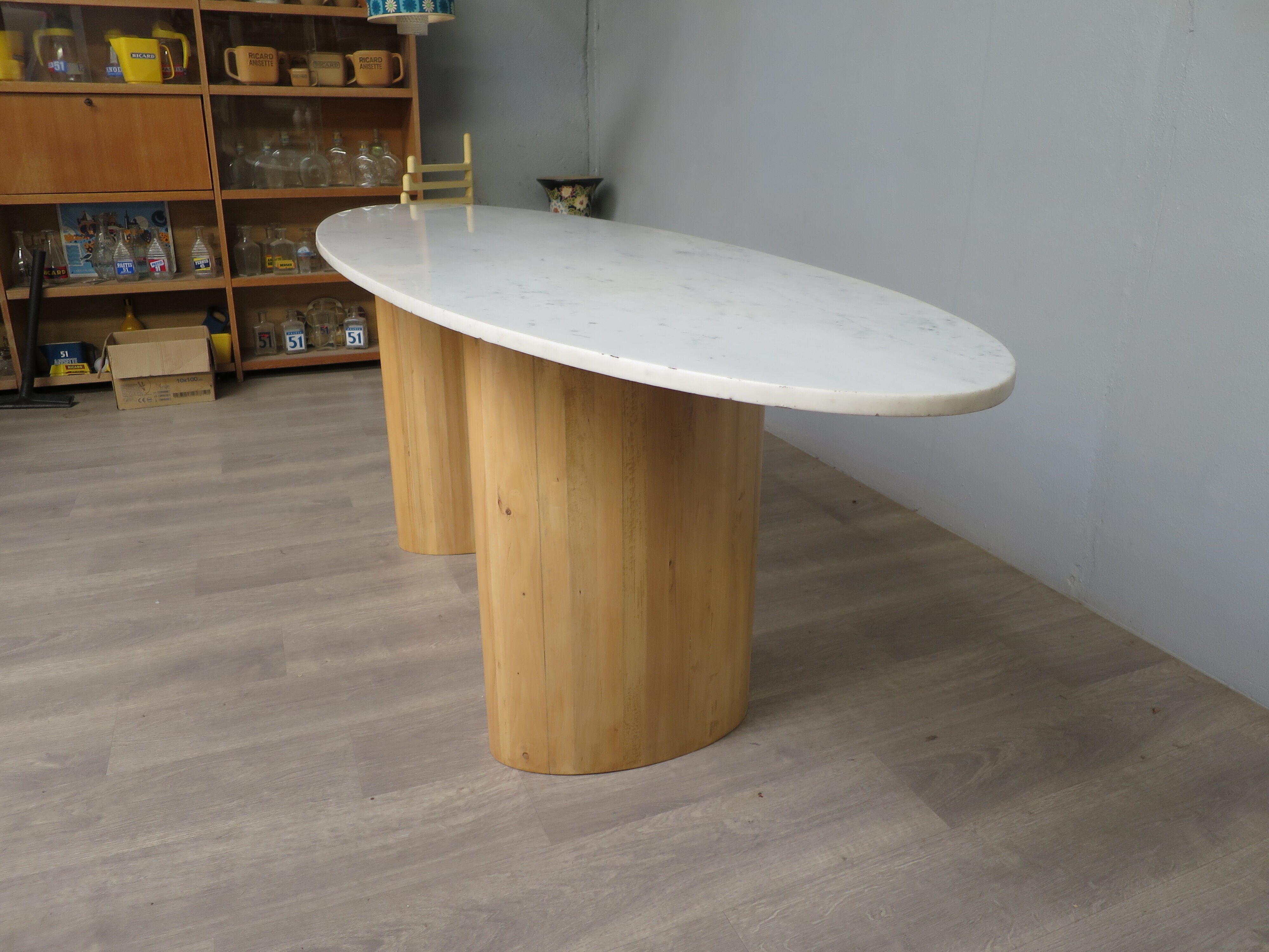 Oval table in Carrara marble and wood