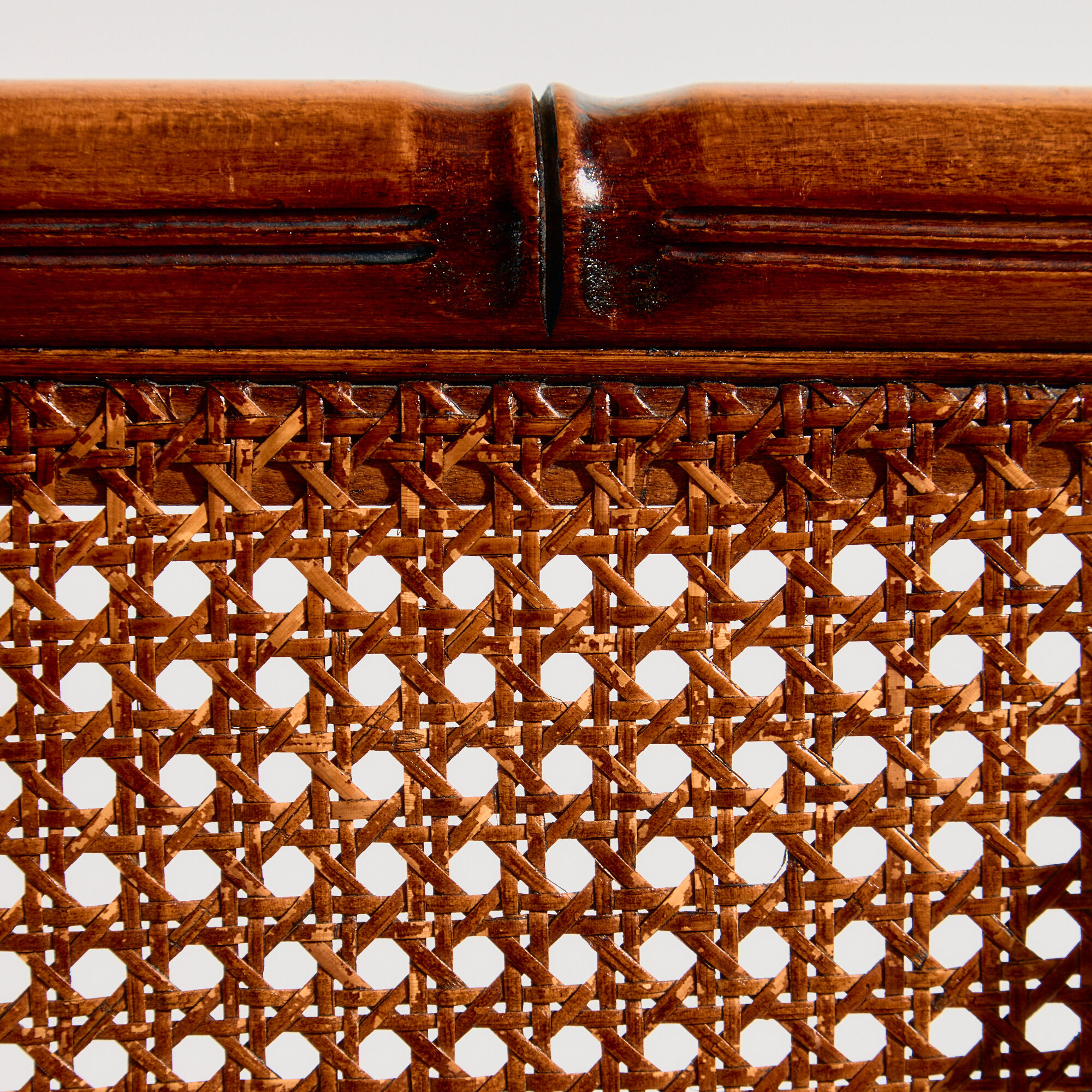 Walnut armchair with bamboo design