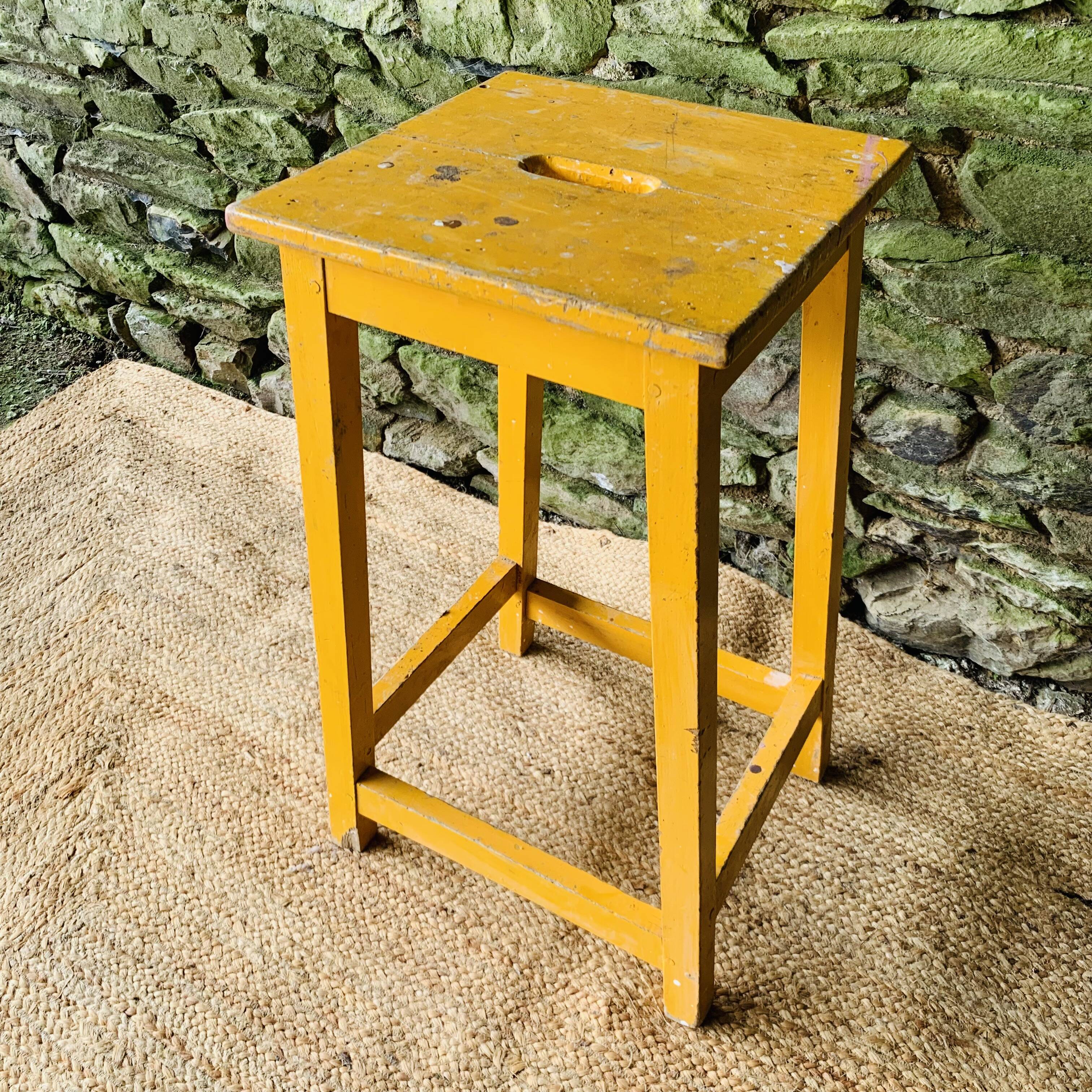 Yellow wooden high stool