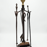 Antique fireplace set in solid wrought iron and brass.