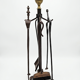 Antique fireplace set in solid wrought iron and brass.