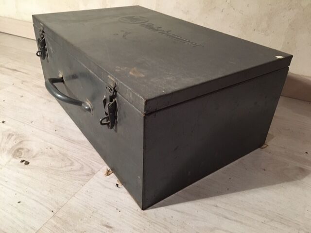 A crate, box or metal suitcase in undue style 60/70