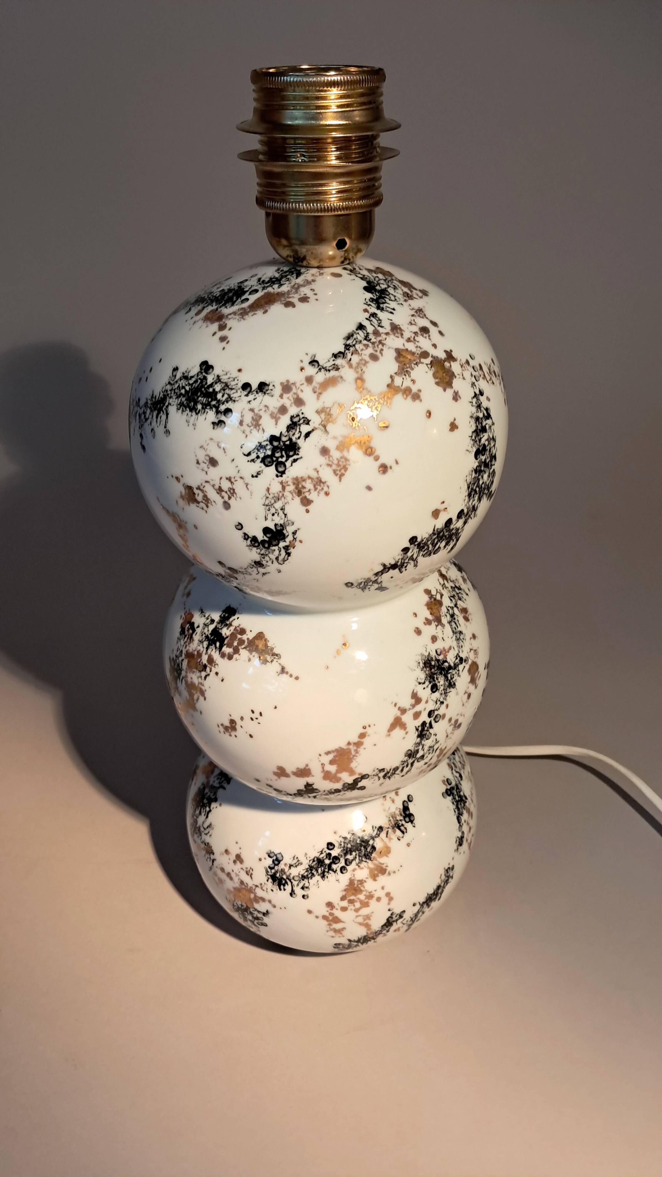 Fine porcelain lamp painted and gilded with fine gold. Laure Selignac, Paris.