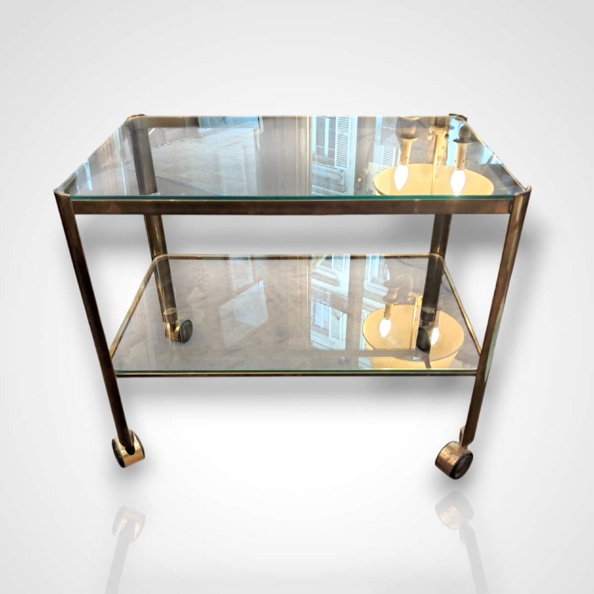 Jacques Quinet for Broncz, wheeled cart in bronze and glass, 20th century.