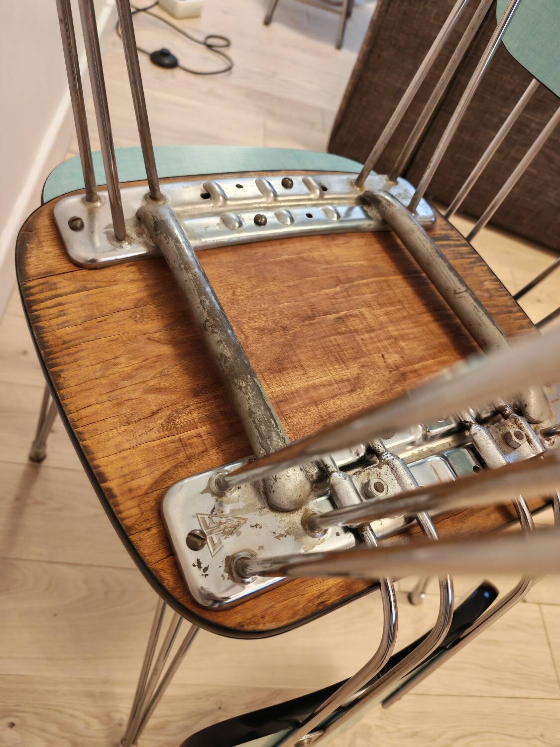 Pair of green Formica chairs with Eiffel legs