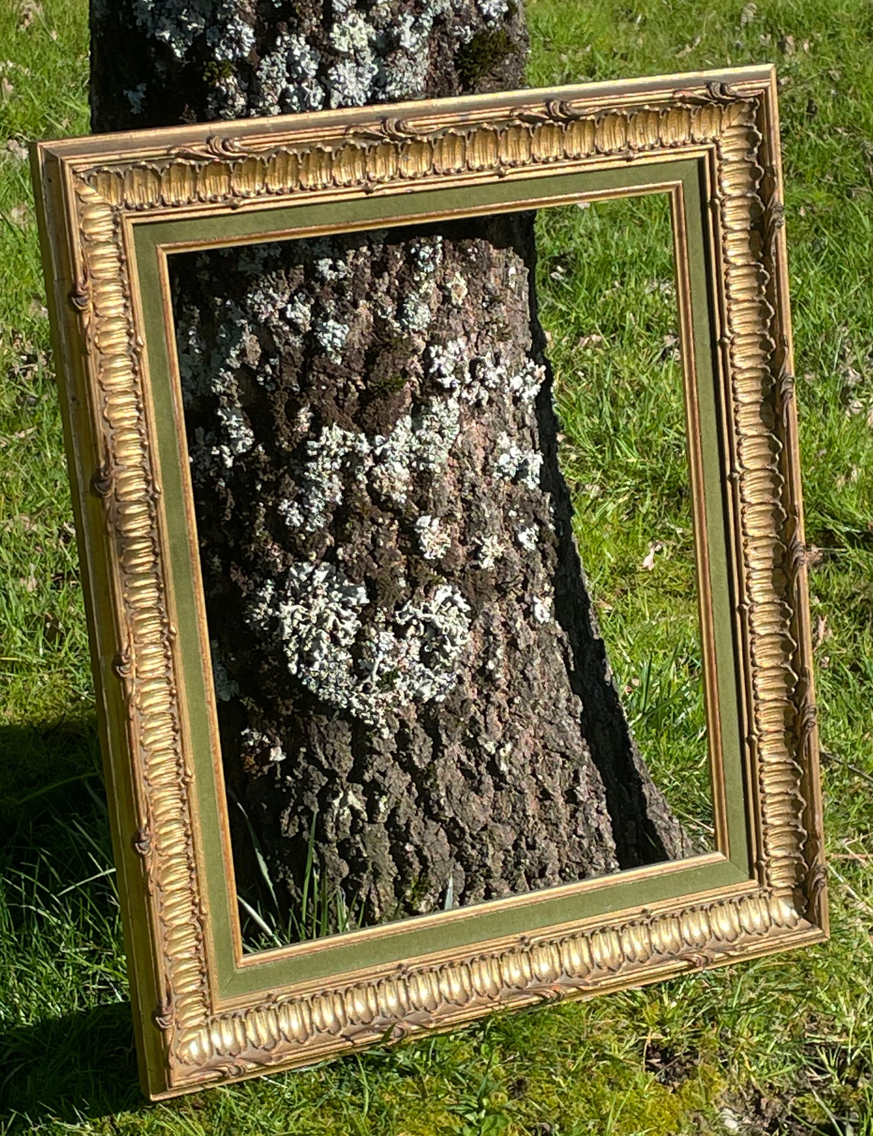 Frame carved wood and gilded stucco