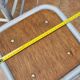 Set of four stackable industrial tubular metal and wood stools