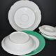Paris porcelain set of 3 plates and a sauce boat with green border and gold monogram JC.