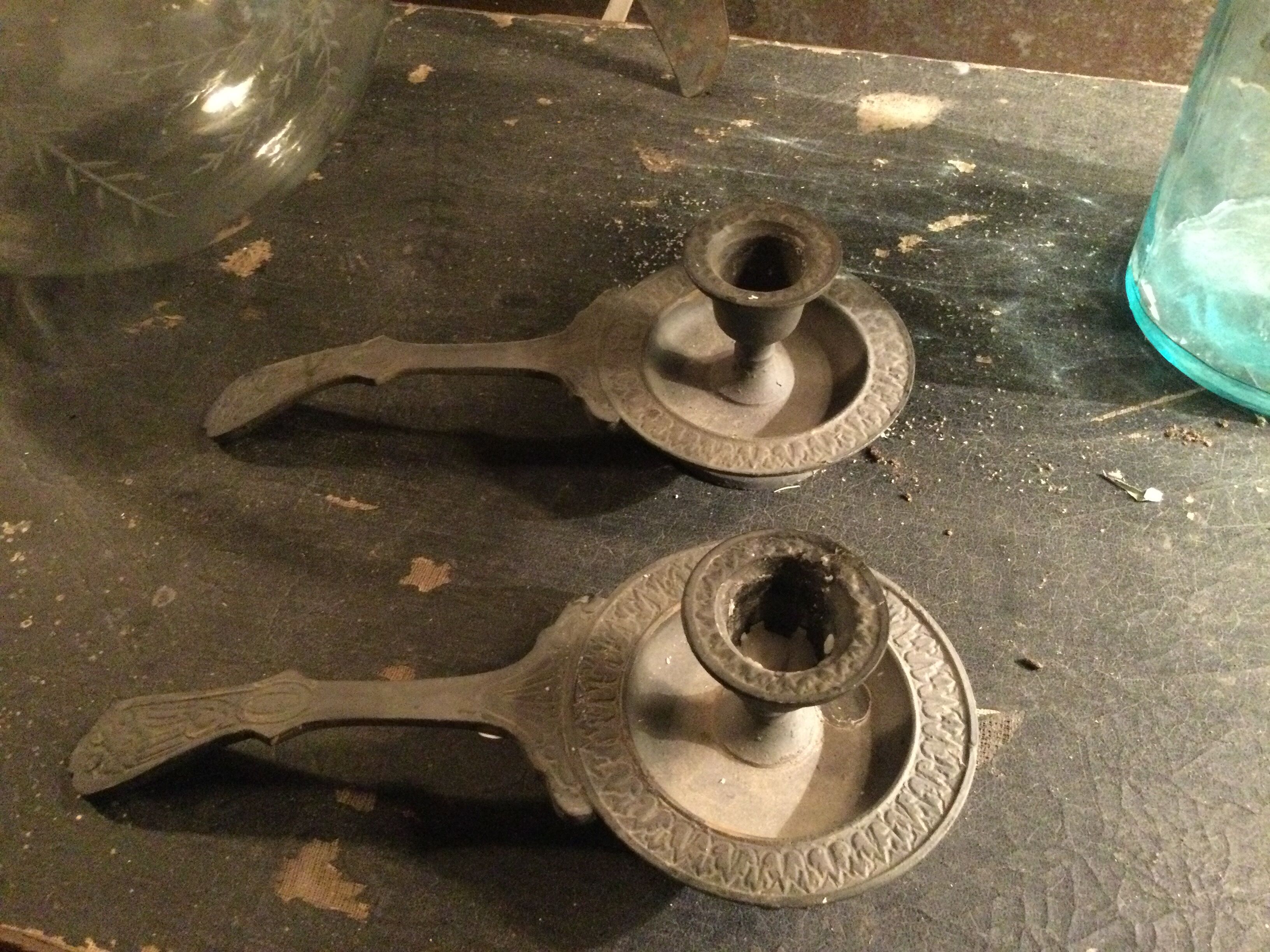 Pair of cast iron candle holders