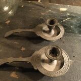 Pair of cast iron candle holders