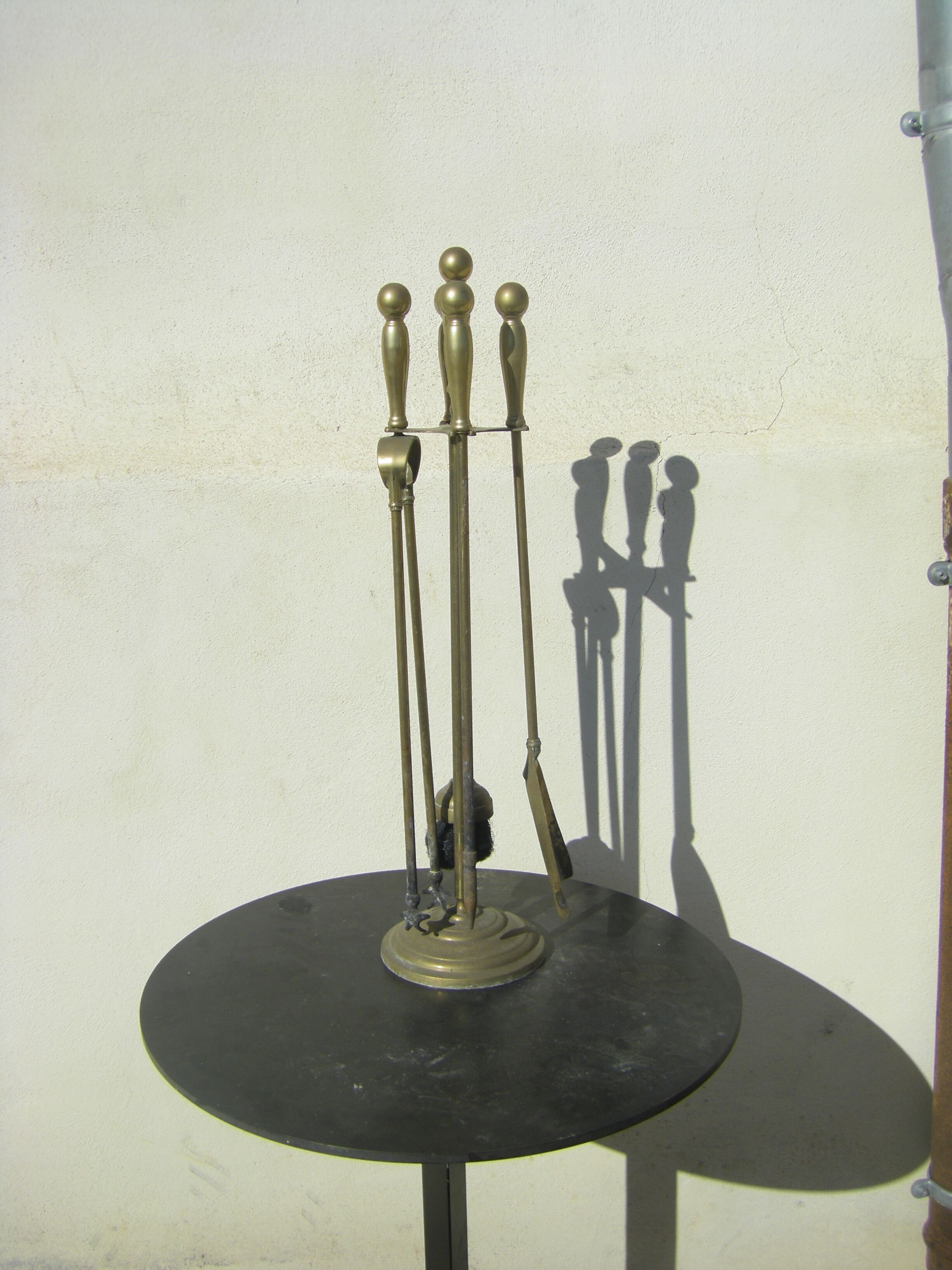 Gilded brass fireplace servant.