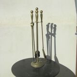 Gilded brass fireplace servant.