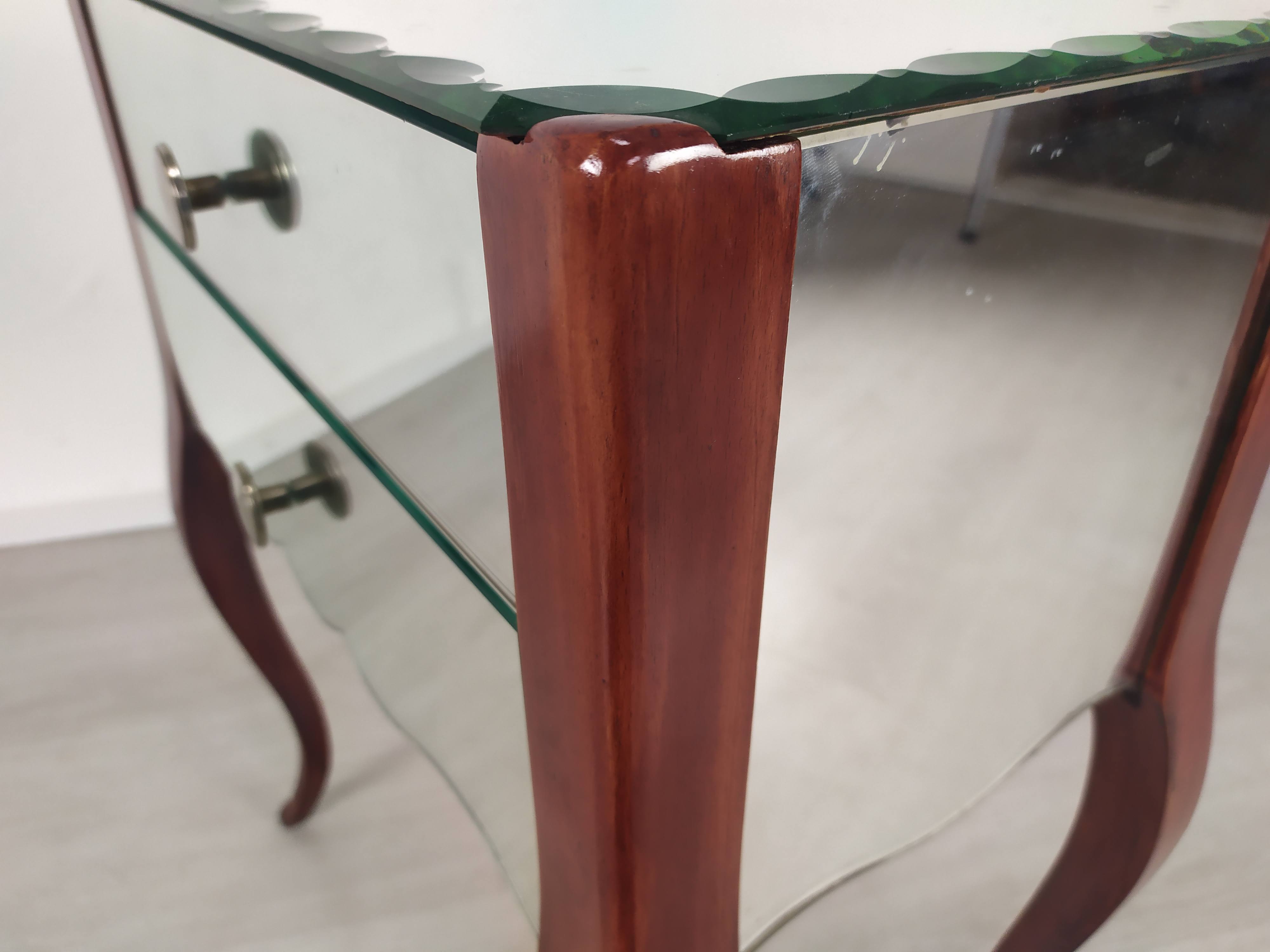 Glass art deco mirror beside table