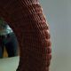 Round mirror, dark rattan