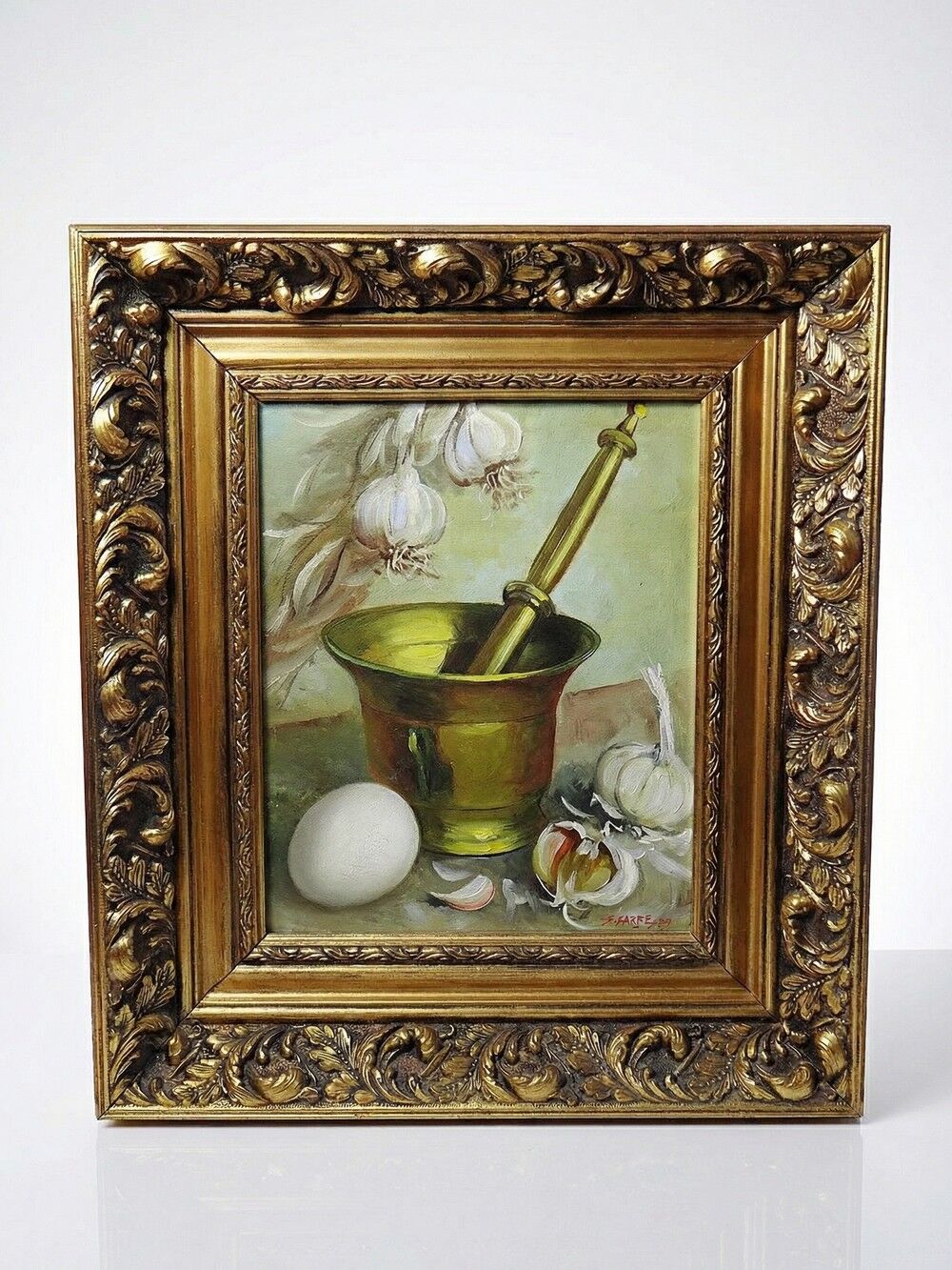 Still life with garlic, egg, and mortar signed Sarpe, 1979, oil on canvas.