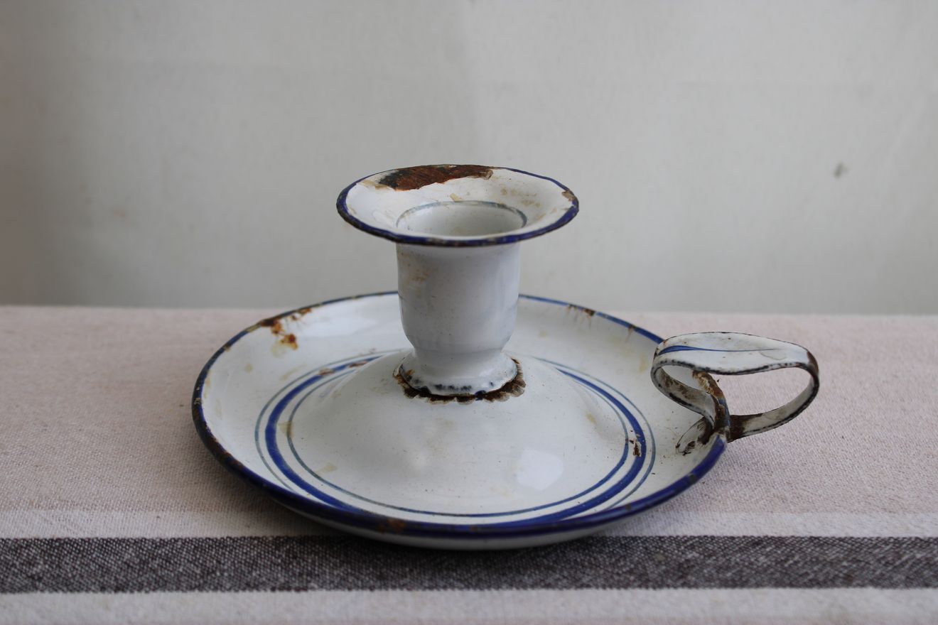 Old enamel candle holder