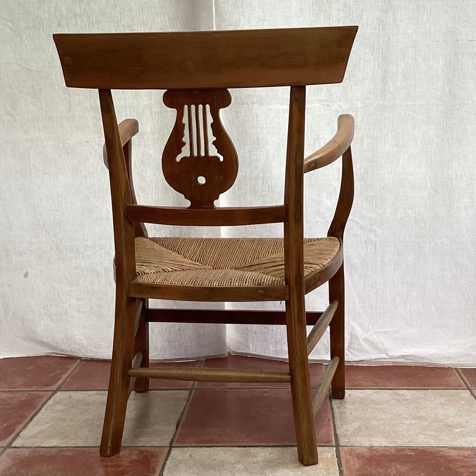 Light wood armchair seated in vintage straw dimension: height -78cm- width -54cm-