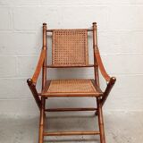 Bamboo folding armchair and caning, leather and brass