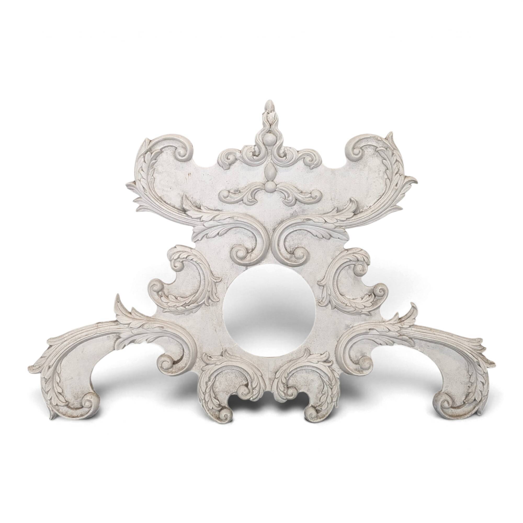 Large rococo fronton in stucco and carved wood, patinated white with an oculus.