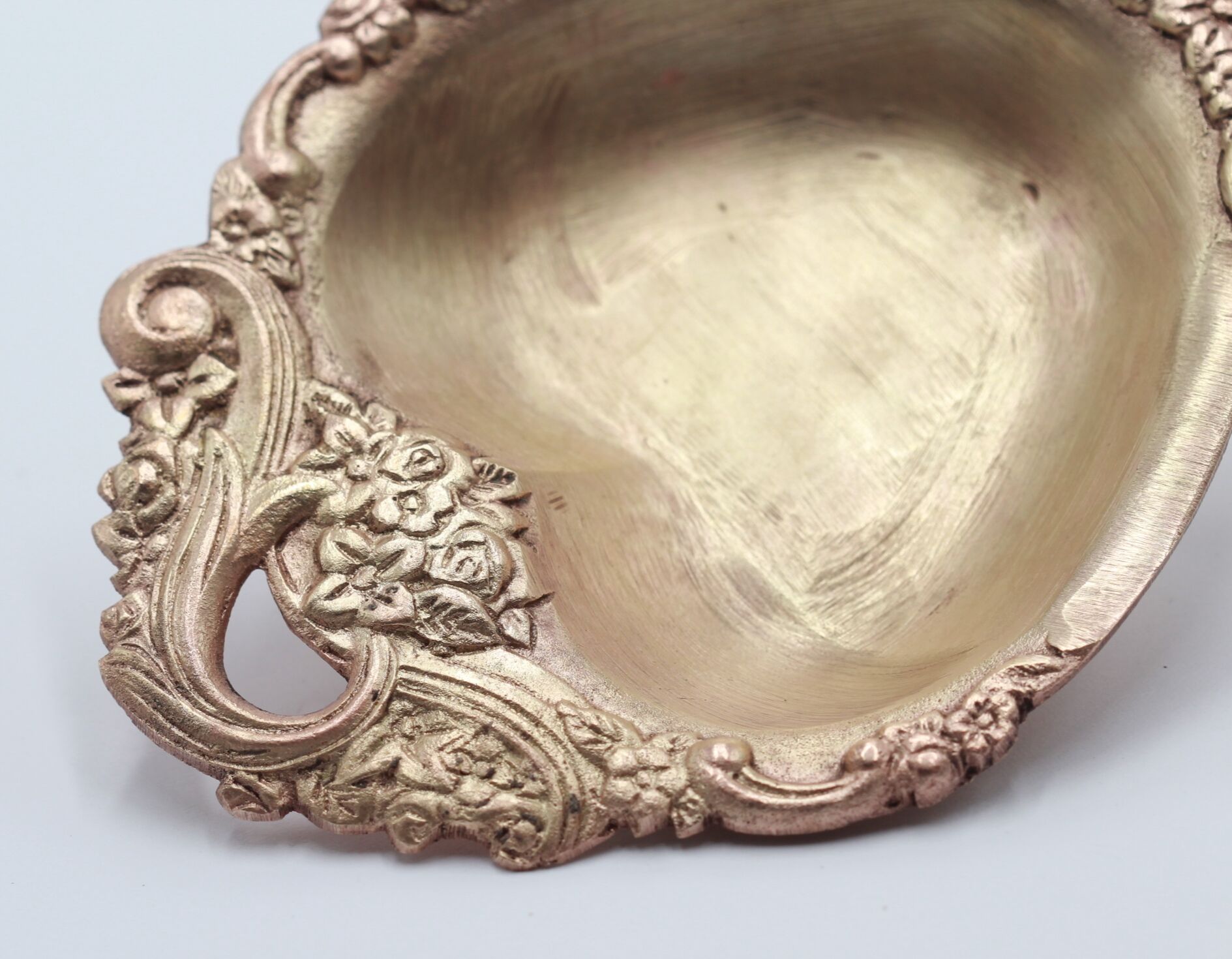 Empty brass heart pocket