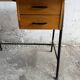 Black metal and wood mid-century industrial desk with laminated top and two drawers