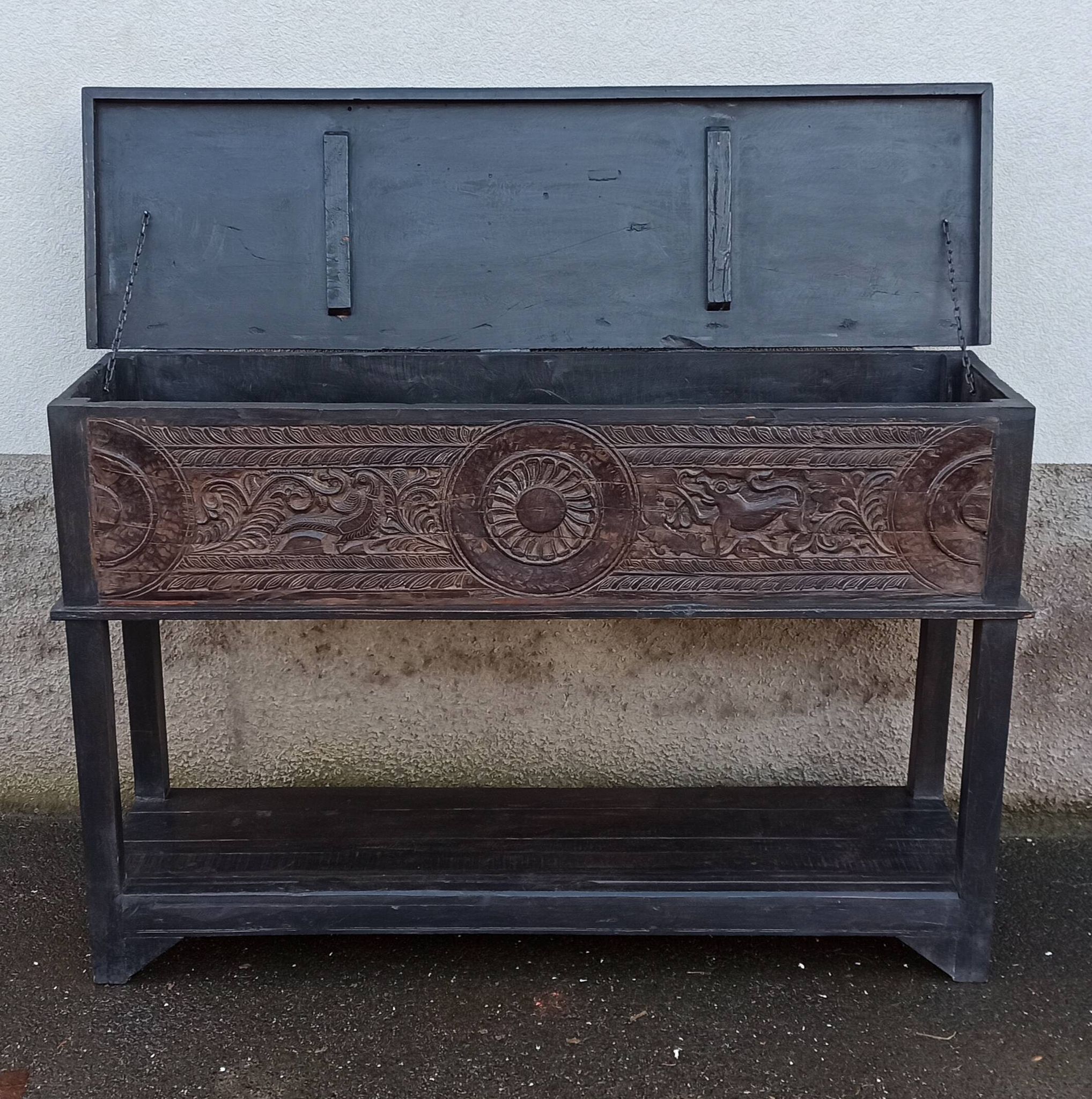 Console in old black wood with integrated chest