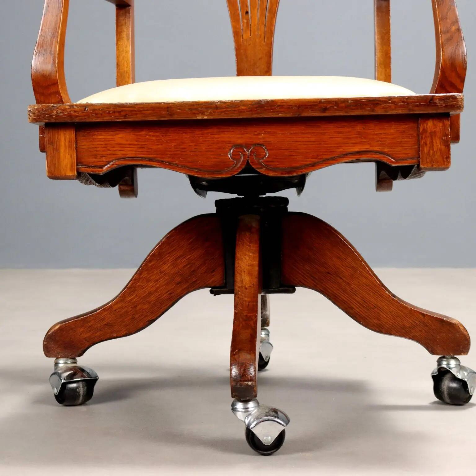 Antique oak swivel chair with wheels UK 20th Century
