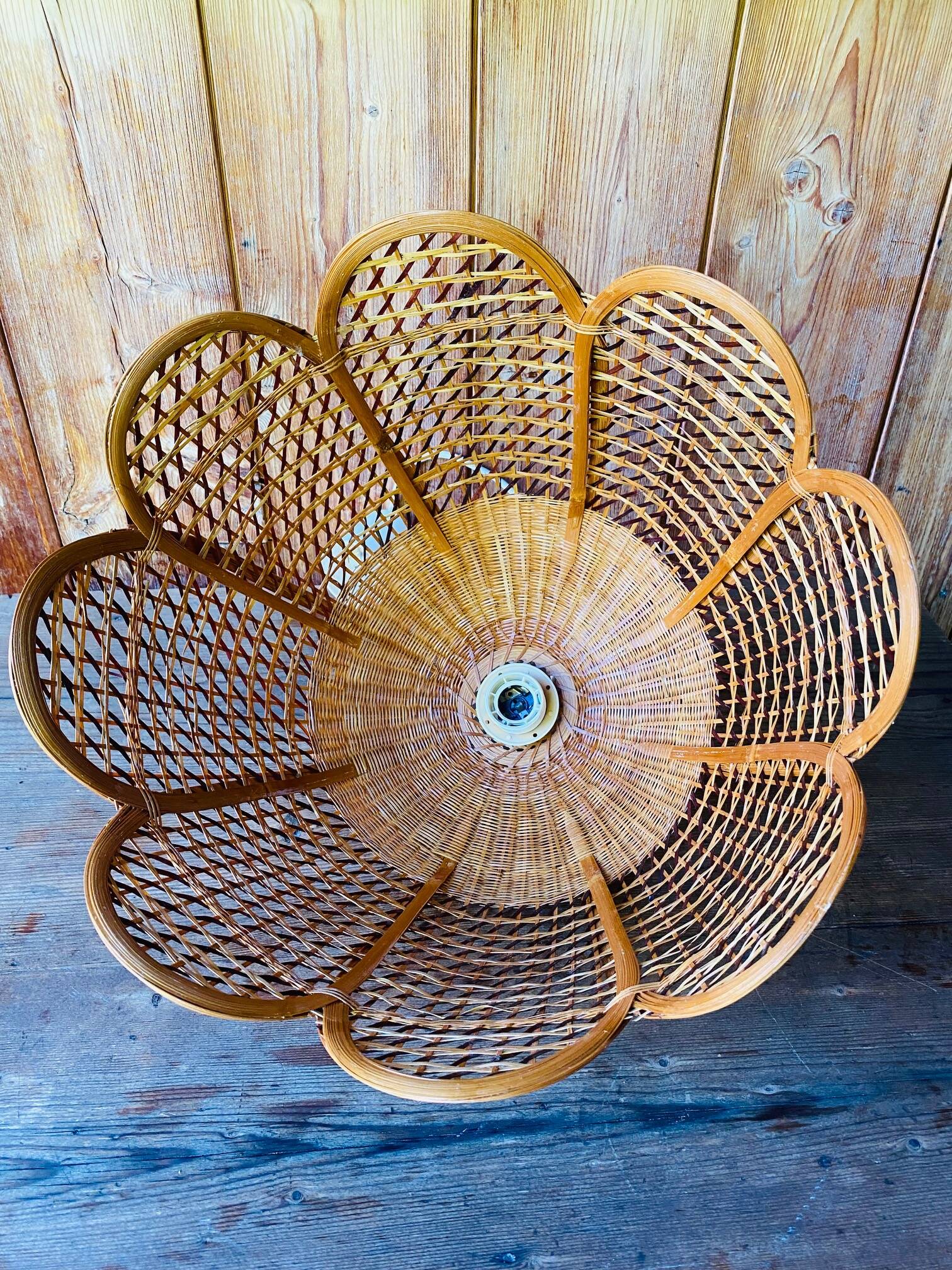 Rattan and cane lampshade in the shape of a flower from the 1970s.