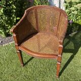 Fauteuil en bois fruitier et cannage style Louis XVl