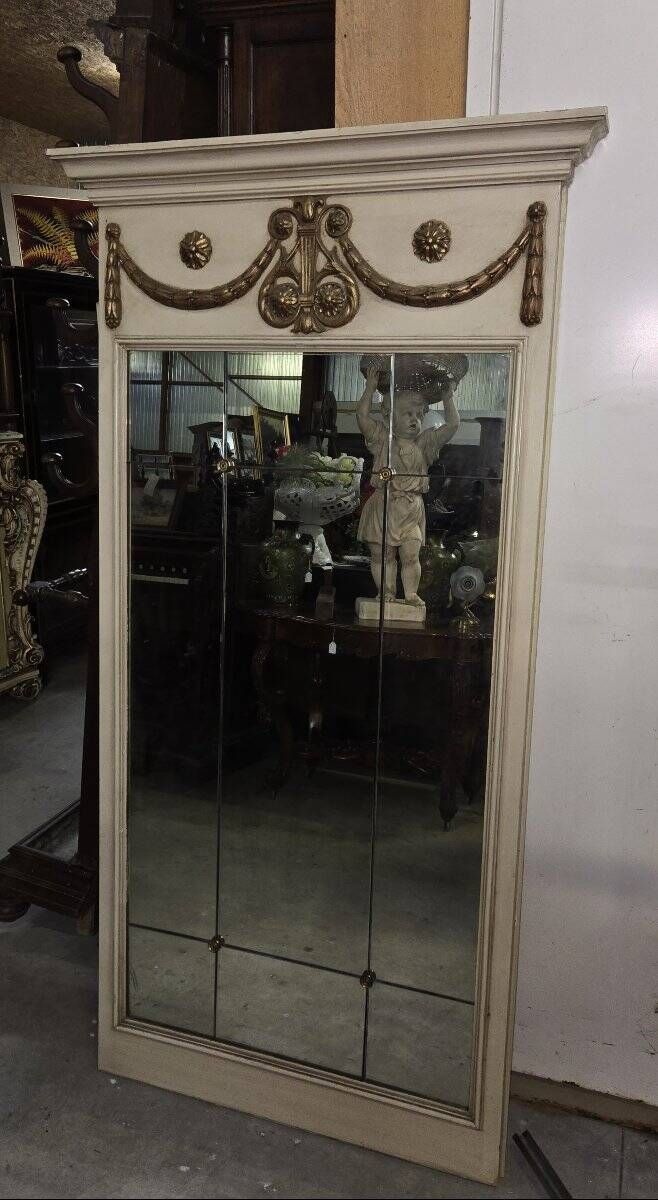Louis XVI style trumeau mirror with a painted wooden frame.