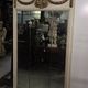 Louis XVI style trumeau mirror with a painted wooden frame.