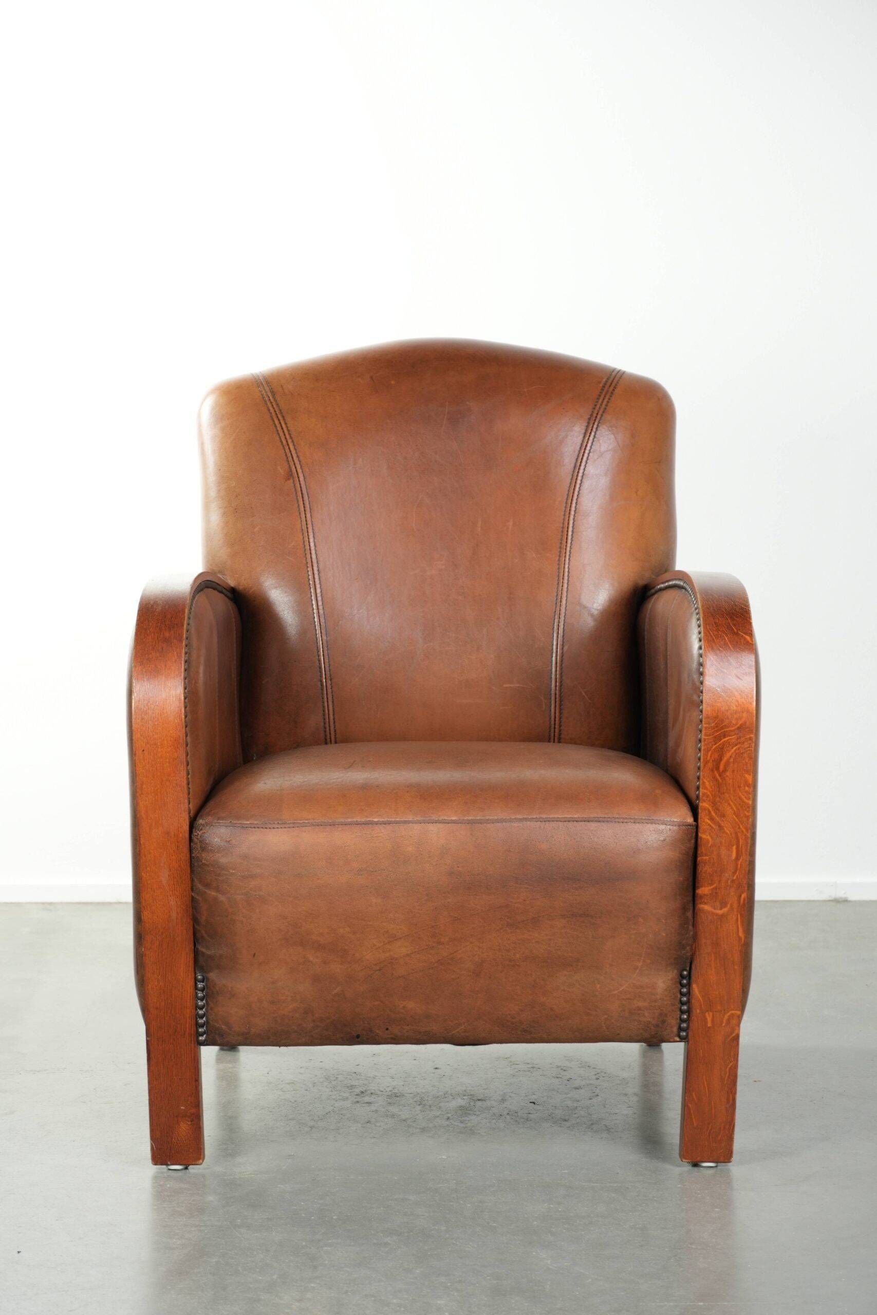 Sheepskin armchair in Art Deco style with wooden armrests