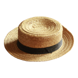 Old straw hat with black ribbon
