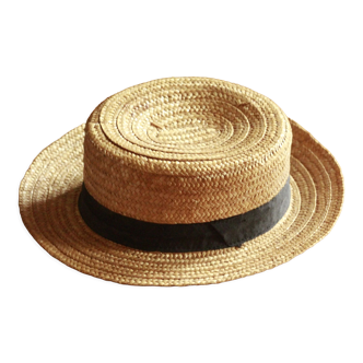 Old straw hat with black ribbon