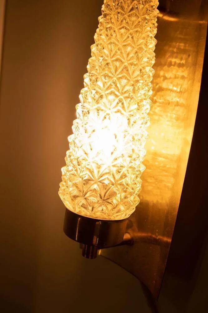 Vintage glass wall sconce from the 1960s in brass, mid-century light.